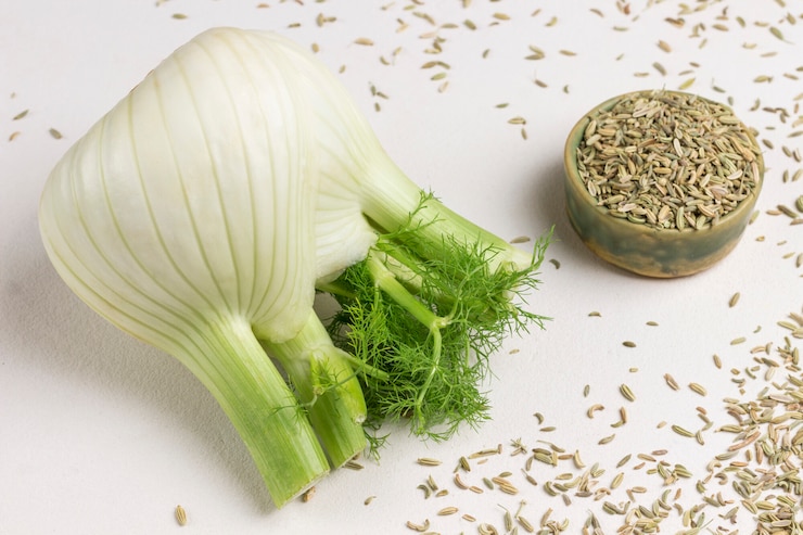 Photo fennel bulb on table, fennel seeds in box. healthy nutrition.