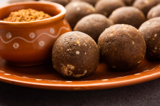 Photo fenugreek or methi ke laddu laddo or laddoo or sweet mithai balls for boosting immunity in winters