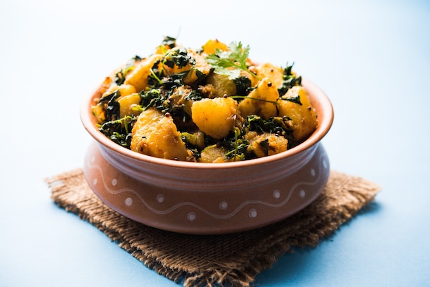 Fenugreek potato sabzi or Aloo Methi masala is healthy Indian Cuisine. served in a bowl or karahi. selective focus