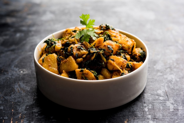 Fenugreek potato sabzi or Aloo Methi masala is healthy Indian Cuisine. served in a bowl or karahi. selective focus