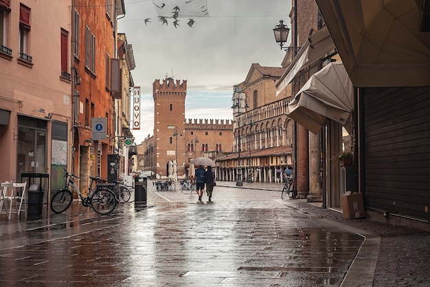 FERRARA, ITALY 29 JULY 2020 : Ferrara alley with a view of the castle and the main square