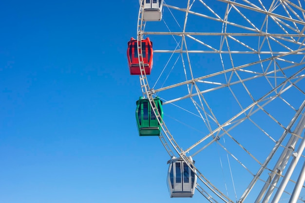 Ferris wheel against the clear blue sky