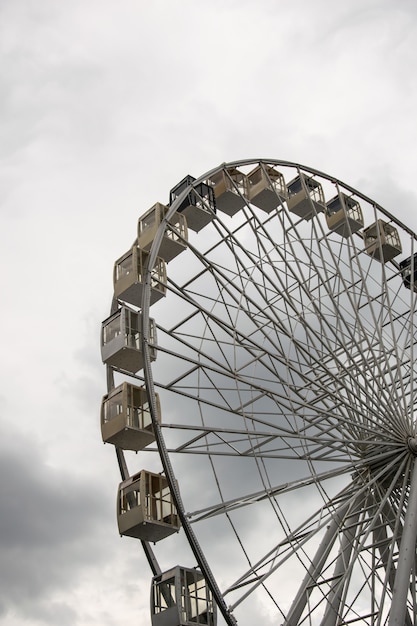 Ferris wheel against the sky in cloudy weather