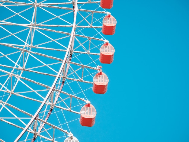 Ferris Wheel Over Blue Sky Background