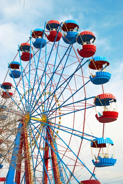 Ferris wheel on the blue sky surface