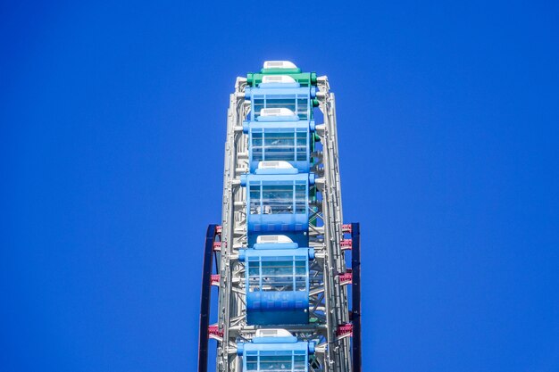 Ferris wheel on the blue sky