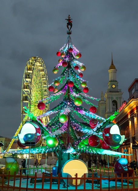 Ferris wheel and New Year tree in Podil. Kiev.