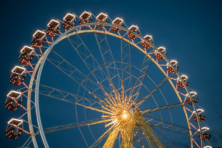 Photo ferris wheel in a night park. entertainment in the park