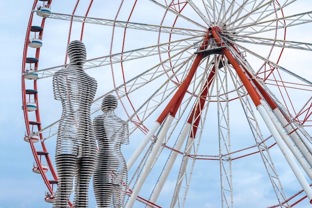 The Ferris wheel and the statue of Ali and Nino on the embankment of Batumi Georgia Batumi