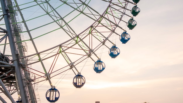 Ferry wheel on sunset sky 