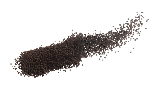 Photo fertilizer brown chemical accelerate growth fly fall explosion many tiny ball fertilizer for planting float throw in mid air white background isolated high speed freeze motion