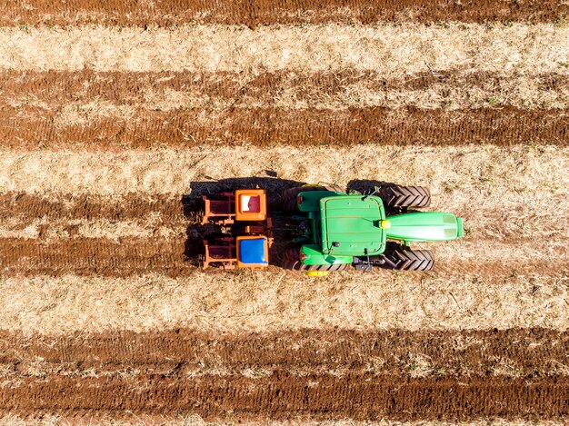 Fertilizing land where sugar cane was planted aerial view.