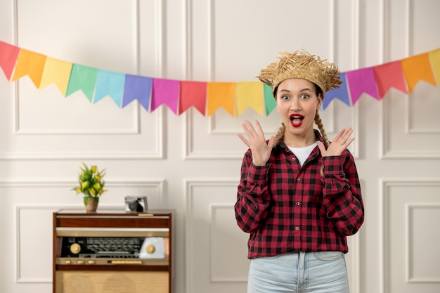 Festa junina cute girl in straw hat brazilian midsummer with retro radio colorful flags