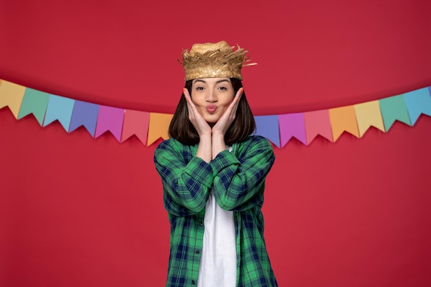 Festa junina happy cute girl wearing straw hat celebrating brazilian festival sending kisses