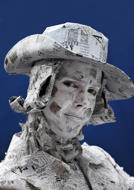 Photo festival of living statues portrait of a paper man living statue