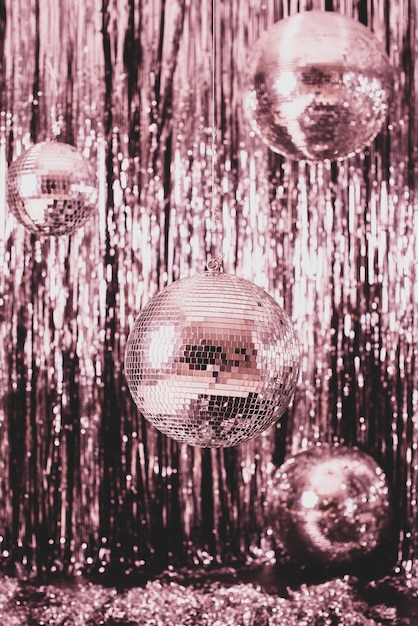 Festive background. disco ball on pink background.