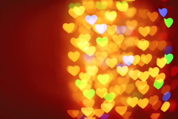 Festive background of lights in hearts shape