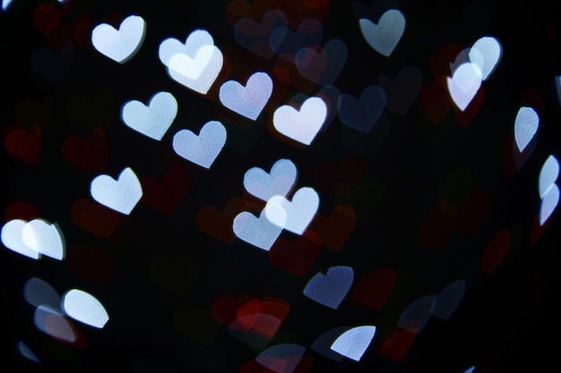 Photo festive background of lights in hearts shape