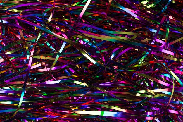 Festive background. Lots of multicolored tinsel close-up.