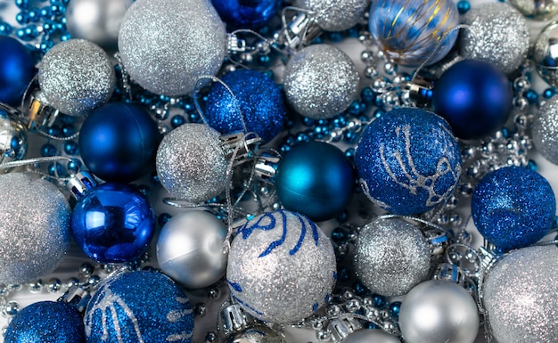 Festive background with blue and silver sparkling christmas balls.