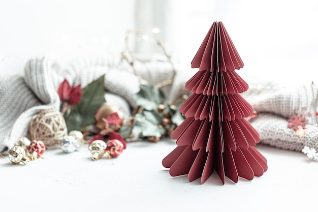 Festive background with decorative cardboard Christmas tree copy space