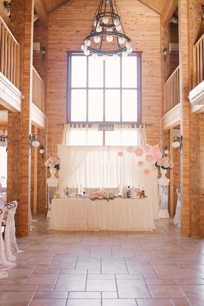 Festive Banquet table of the bride and groom in a rustic restaurant