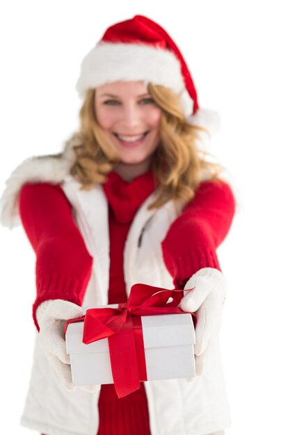 Festive blonde giving red gift 