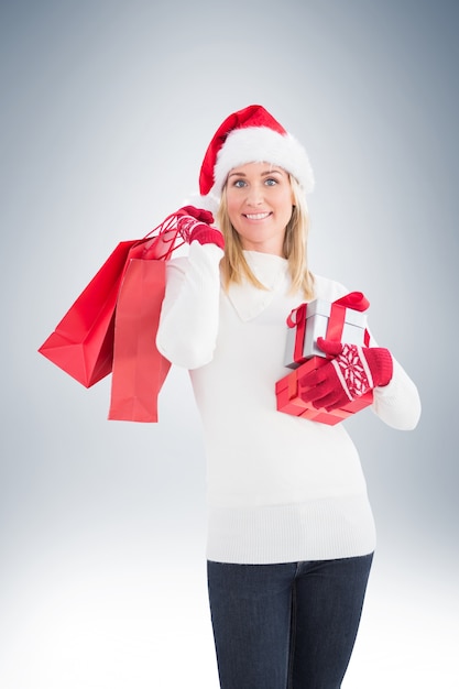 Festive blonde holding christmas gifts