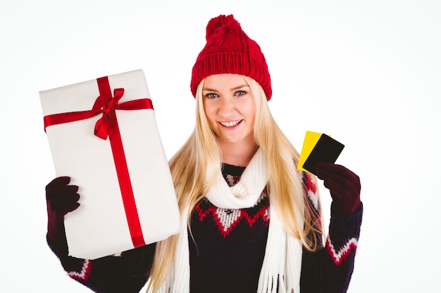 Festive blonde holding a gift