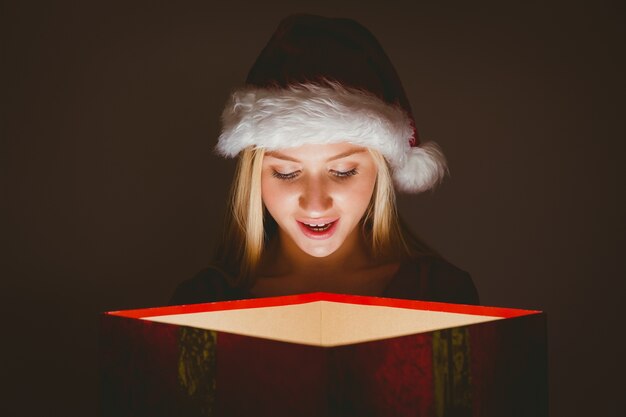 Festive blonde holding a gift