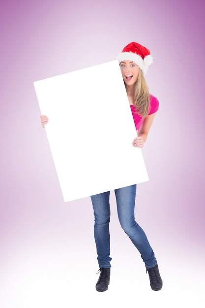 Festive blonde holding large poster 