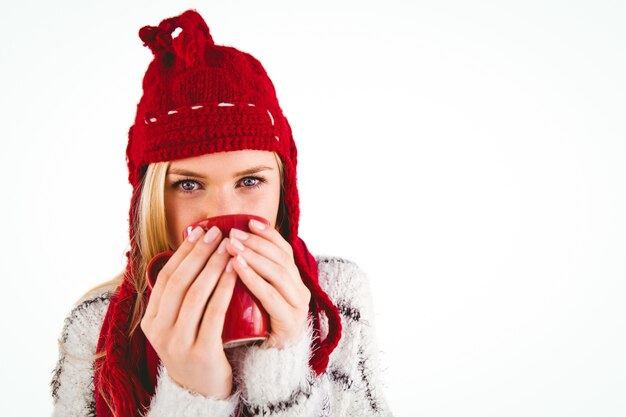 Festive blonde holding a mug