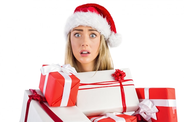 Festive blonde holding pile of gifts