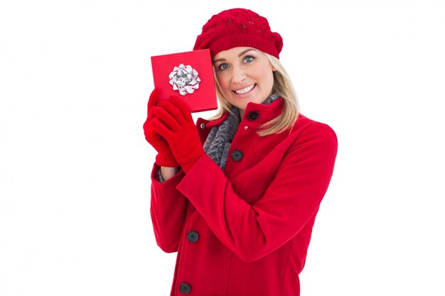 Festive blonde holding red gift 