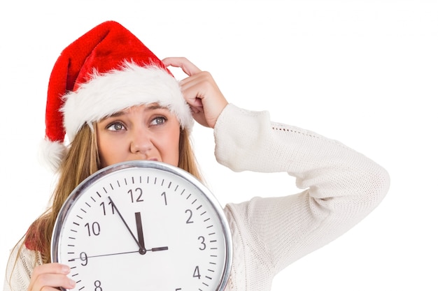 Festive blonde showing a clock