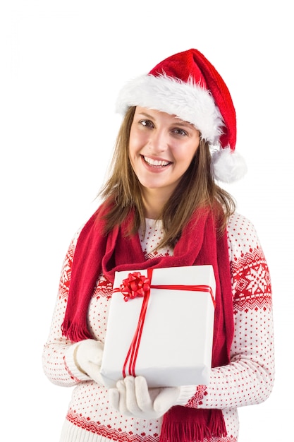 Festive brunette holding a gift