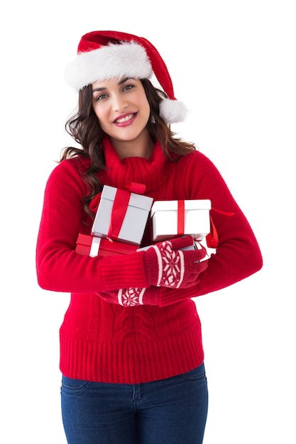 Festive brunette holding many gifts