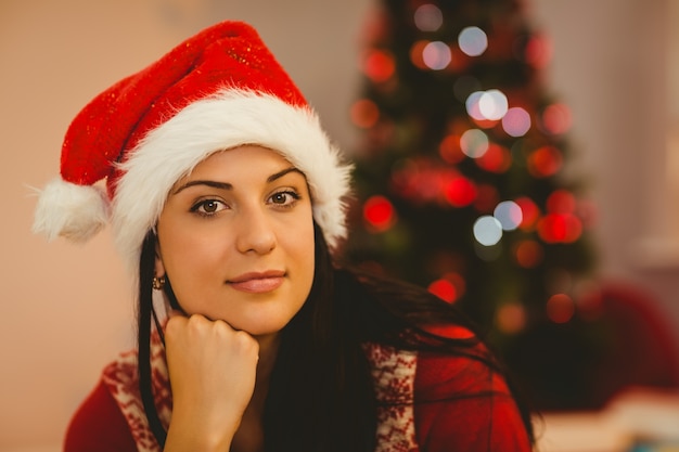 Festive brunette wearing a santa hat