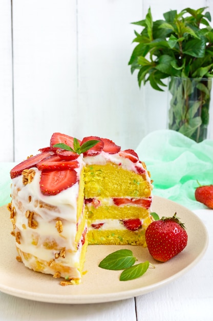 Festive cake with strawberries and mint leaves