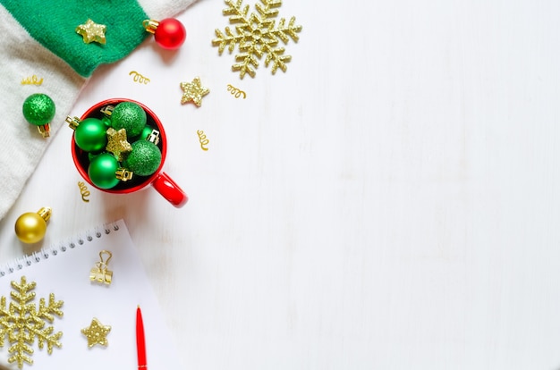 Festive christmas accessories on white wooden background