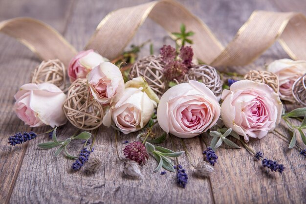 Festive close up flower English rose, lavender composition with ribbon on wooden background. Overhead top view, flat lay. Copy space. Birthday, Mother's, Valentines, Women's, Wedding Day concept.