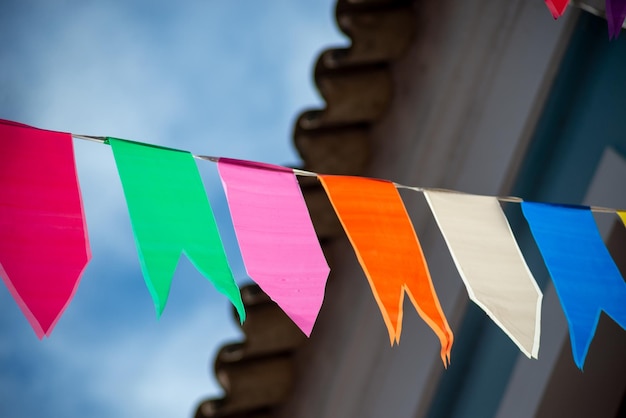 Festive decoration flags of different colors hanging with string decorative plastic