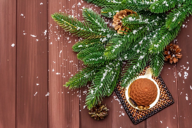 Festive dessert in the shape of a Christmas fir cone. New Year sweet treat concept.