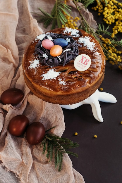 Festive easter chocolate cake with easter eggs and flowers