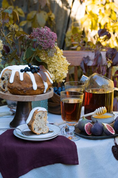 Festive fall romantic table setting with dessert in garden\
table concept family dinner