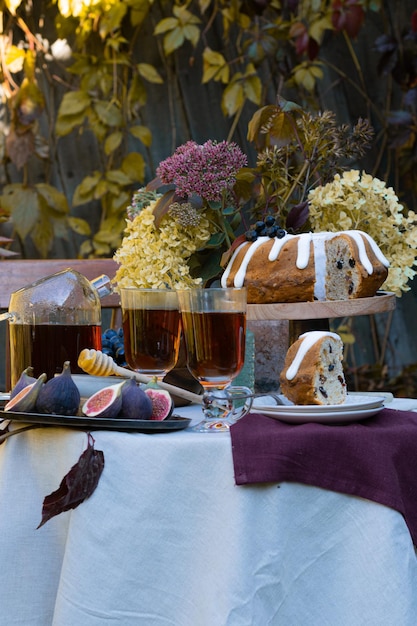 Festive fall romantic table setting with dessert in garden\
table concept family dinner