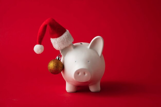 Festive financial savings concept piggy bank with christmas decorations