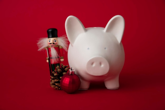 Festive financial savings concept piggy bank with christmas decorations