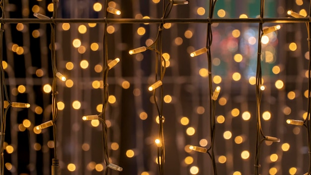 Photo festive garland on the street. background