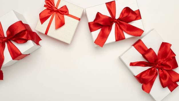 Festive gift boxes with red bows